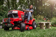 Photo of Craftsman red riding lawn mower CM13APA9ZSA93 in a garden setting, front side view with visible T2200X label.
