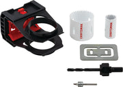 Photo of CRAFTSMAN hole saw kit CMAH1WDL with black plastic guide, two white hole saws, drill bit, metal plate, and mandrel, front angle.