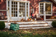 Photo of CRAFTSMAN leaf blower CMCBL700M1 used outdoors to clear leaves from porch steps.
