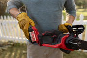 Photo of Craftsman chainsaw CMCCS630P1 cutting a tree branch outdoors, close-up on chain and blade.