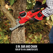 Photo of Craftsman cordless chainsaw CMCCSL621B cutting tree branch outdoors, red and black design visible.