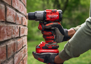 Photo of Craftsman cordless drill CMCD726B being used on brick wall outdoors.
