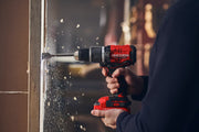 Photo of CRAFTSMAN cordless drill CMCD732D2 in use, drilling into wood, showing red and black design.