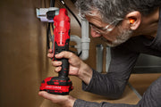 Photo of Craftsman cordless right angle drill, SKU CMCD750B, being used under a sink to drill into wood.