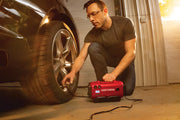 Photo of Craftsman CMCE520B portable inflator used to fill a car tire in a garage setting.