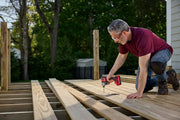 Photo of Craftsman CMCF830B impact driver being used to install deck boards outdoors.