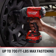 Photo of CRAFTSMAN CMCF940M1 cordless impact wrench being used on a car wheel, black and red design visible.