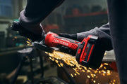 Photo of Craftsman cordless grinder SKU CMCG451B in use, red and black body, sparks flying, workshop background.
