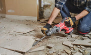 Photo of Craftsman cordless rotary hammer CMCH234B being used to remove floor tiles in a renovation setting.