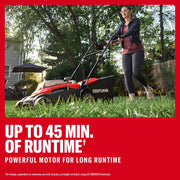 Photo of Craftsman lawn mower CMCMWP120M2 in use on grass, outdoor setting, side view, black and red design.
