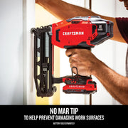 Photo of Craftsman cordless nailer CMCN616B in use on a door frame, showing red and black body, 16 gauge marking.