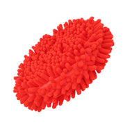 A bright red, oval-shaped microfiber cleaning pad with textured, noodle-like surface.