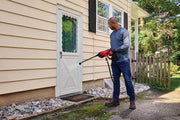 Photo of Craftsman pressure washer CMCPW350B being used on a house exterior, outdoor setting.
