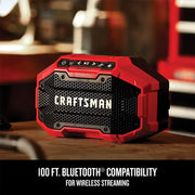Photo of Craftsman CMCR001B red Bluetooth speaker on a workbench, featuring rugged design and wireless streaming.