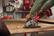 Photo of CRAFTSMAN cordless circular saw CMCS405B cutting wood, close-up of tool in use on workbench in workshop.