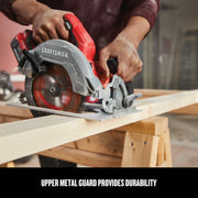 Photo of Craftsman CMCS550B circular saw in use cutting wood, red and silver design, visible upper metal guard.