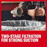 Photo of hands cleaning Craftsman two-stage vacuum filter CMCVHF10 over a trash bin, showing dust removal feature.