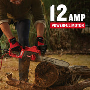 A person wearing red gloves is using a CRAFTSMAN electric chainsaw to cut a log outdoors. The image highlights the chainsaw's 12 amp powerful motor feature.