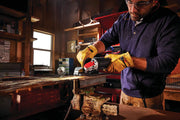 Photo of CRAFTSMAN CMEG200 angle grinder in use, grinding metal and producing sparks in workshop setting.