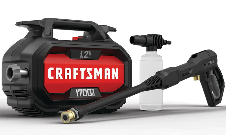 Front angle photo of CRAFTSMAN CMEPW1700 pressure washer, black with red panel, spray gun and soap bottle.