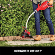 Craftsman string trimmer CMESTHOS912 in use beside hedge, red and black design, photo outdoors.