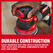 Photo of Craftsman CMEW231 sheet sander in use, red and black design, visible on wood surface, shown in a workshop.