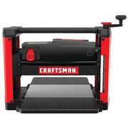 Front angle photo of Craftsman wood planer CMEW320, red and black, with depth scale and folding trays.
