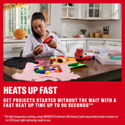 Photo of a person using a Craftsman cordless glue gun CMGL100B for crafting, surrounded by craft supplies and pom poms in a kitchen.