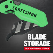 Photo of CRAFTSMAN CMHT10352 utility knife in green, close-up on drop-down blade storage compartment open with blades visible.