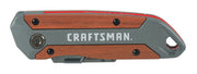 Photo of Craftsman utility knife CMHT10584, closed, gray and wood with visible logo, side angle.