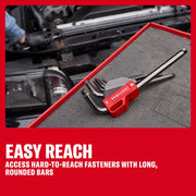 CRAFTSMAN hex key set with red handle placed on a work surface near a vehicle engine bay.