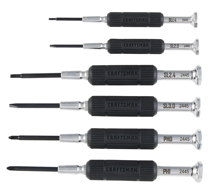 A set of six precision screwdrivers with black textured handles, labeled with the brand 'Craftsman' and different tip sizes and types. The tips include flathead and Phillips, arranged in a row against a white background.