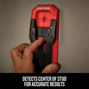 Photo of Craftsman stud finder CMHT77621 in use against a wall, hand pressing button, red and black design.