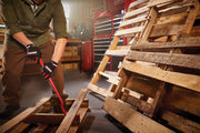 Photo of CRAFTSMAN CMHT82502 gloves used while prying wooden pallets in a workshop.