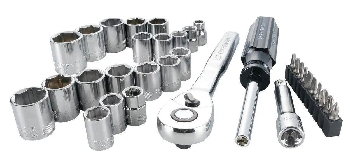 Photo of Craftsman socket and ratchet set, SKU CMMT12013, including chrome sockets, ratchet, screwdriver, and bits, angled view.