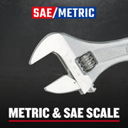 Craftsman adjustable wrench CMMT81622 with SAE and metric scale, close-up on black background.