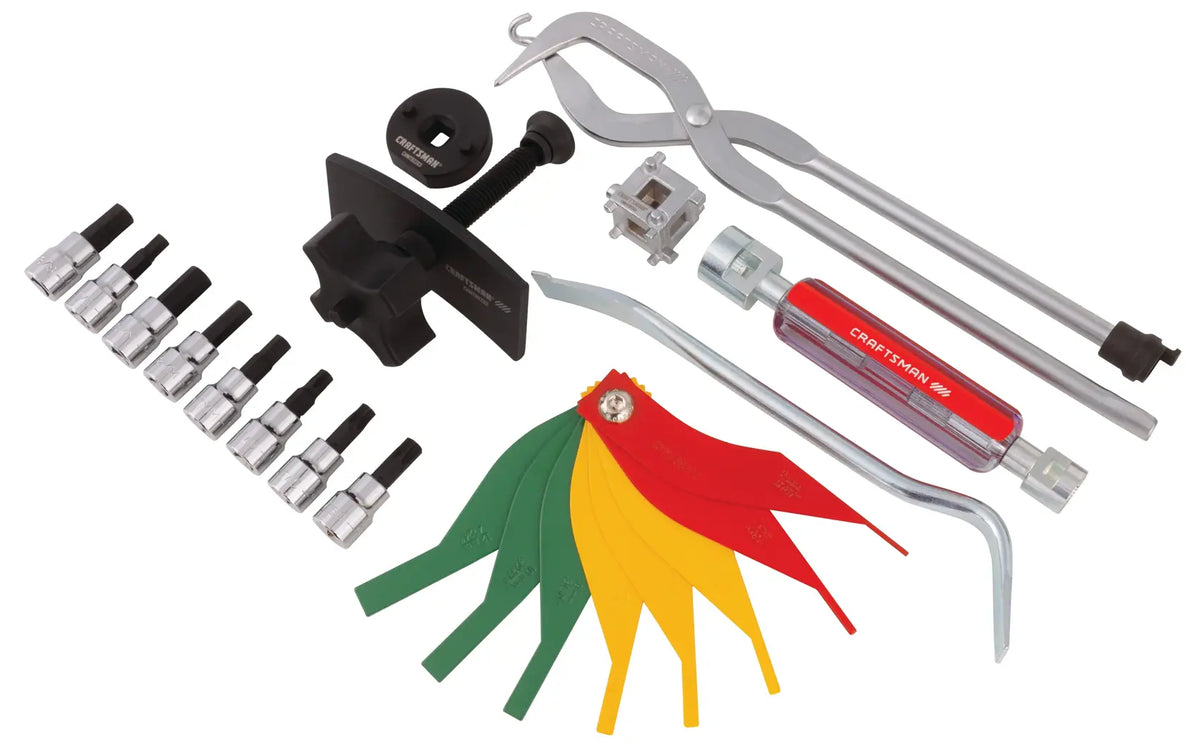 Photo of Craftsman CMMT98283 automotive tool set with assorted wrenches, sockets, and colorful feeler gauges, top view.