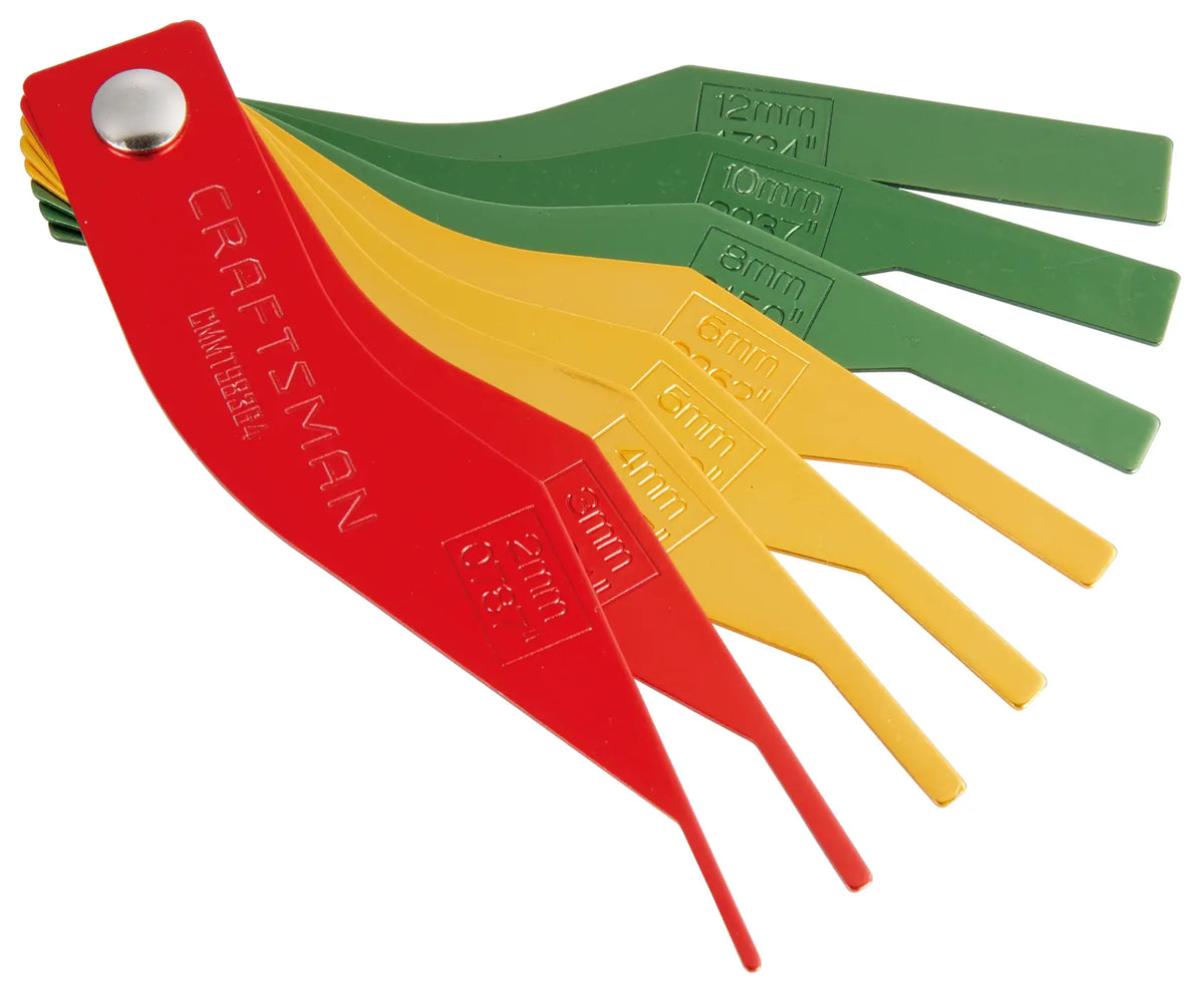 Craftsman CMMT98364 multi-color plastic gap gauge set in red, yellow, and green, photo angled on white background.