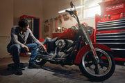 Photo of Craftsman tool chest SKU CMMT99333 in a garage next to a red motorcycle and a person sitting nearby.