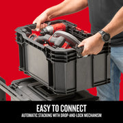 Photo of Craftsman storage box CMST21409 with tools, being stacked using drop-and-lock mechanism, front angle.
