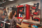 Photo of Craftsman wall cabinet CMST22800RB in a workshop, opened to show tools and supplies inside.
