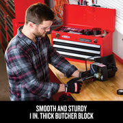 Photo of Craftsman red toolbox CMST27200R open on a workbench with a person in safety gloves using tools.