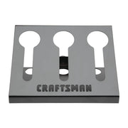 Photo of CRAFTSMAN CMST82696 metal wall-mount tool holder with three keyhole slots, front angle on white background.