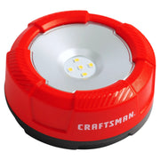 Photo of Craftsman LED puck light CMST98187, red and silver, front angle on white background.