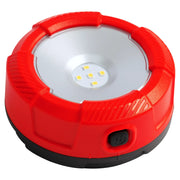 Photo of CRAFTSMAN LED puck light with red casing, visible power button, SKU CMST98187, front angle.
