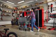 Photo of Craftsman tool cart CMST98276GB in garage setting with red cabinets and organized tools.