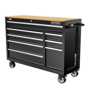 A large black rolling tool chest with multiple drawers and a wood top, designed for organizing and storing tools. The chest has lockable drawers, a side handle, wheels for mobility, and a 'Craftsman' brand label on the front.