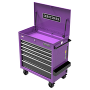 A purple rolling tool chest with multiple drawers, an open top compartment, and the Craftsman logo displayed on the top lid and front. The tool chest has black handles, is mounted on four caster wheels, and features a side tray.