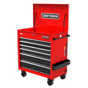 A red rolling tool chest with multiple drawers and an open top compartment labeled 'CRAFTSMAN.' The tool chest is on caster wheels and has a side handle for mobility.