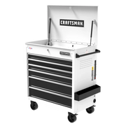 A white and black rolling tool chest with six drawers and a hinged top compartment, branded with 'CRAFTSMAN' on the front and inside the lid. The tool chest has wheels for mobility, a side handle, and side tray for extra storage.